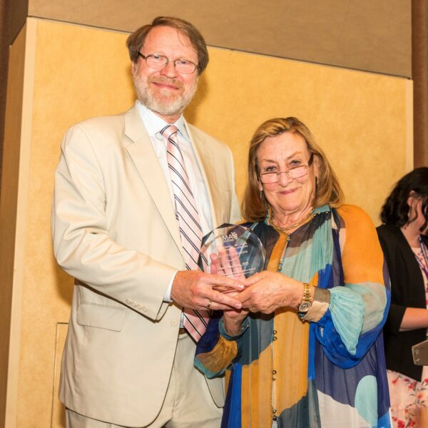 Dr. Machac receives an Excellence in Medicine Award from AMAF President Dr. Mueller