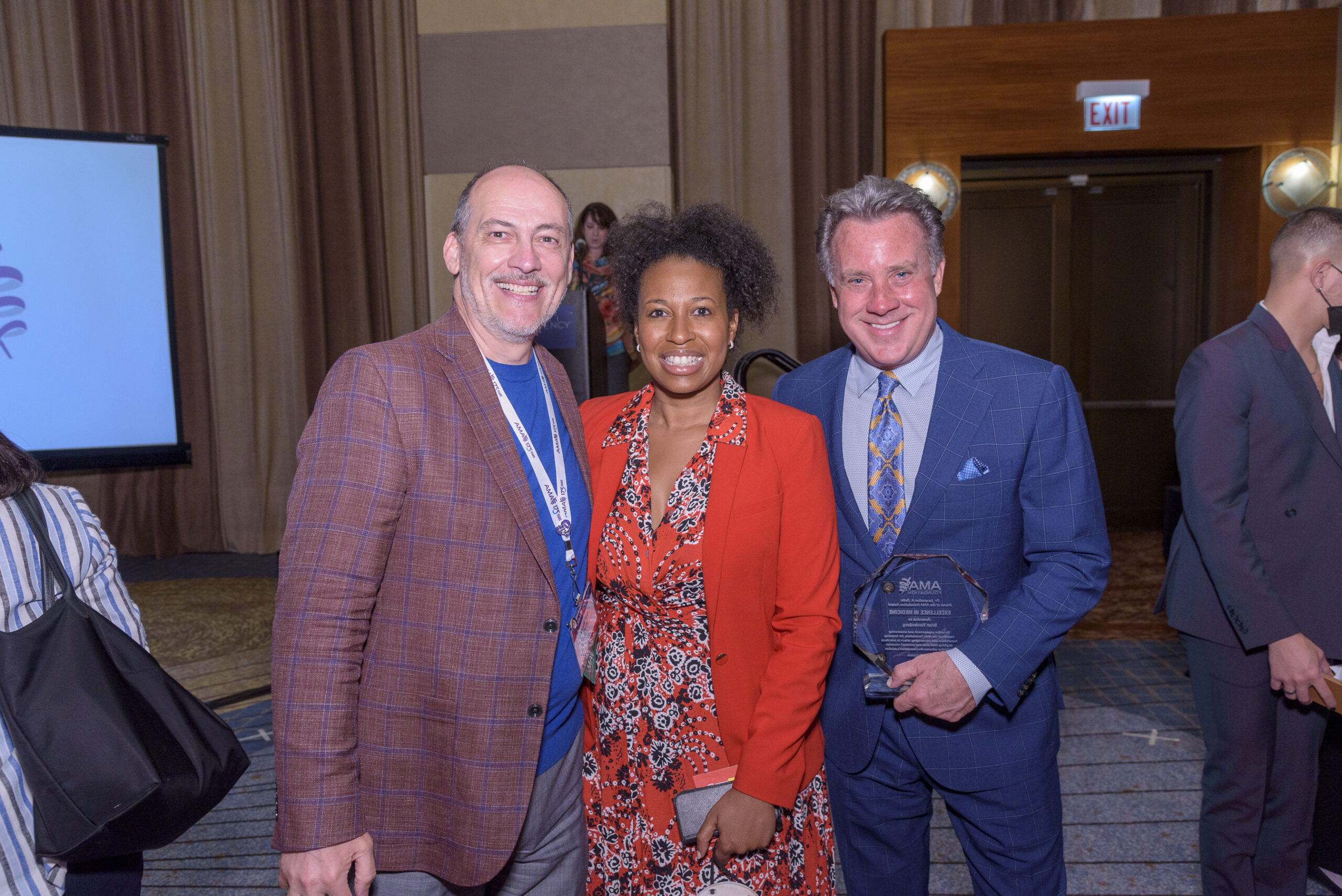 Rodrigo Sierra, Aletha Maybank, and Brian Vandenberg pose for a picture at the 2022 EIM Awards where Vandenberg received the Bello Award.
